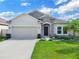 Two-story house with stone and neutral siding at 5364 Ragusa Loop, Saint Cloud, FL 34771