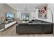 Living area featuring sectional sofa and large TV at 5364 Ragusa Loop, Saint Cloud, FL 34771