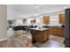 Open kitchen with island and wood cabinets at 5364 Ragusa Loop, Saint Cloud, FL 34771