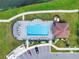 Community pool with lounge chairs and cabana at 5364 Ragusa Loop, Saint Cloud, FL 34771