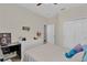 Comfortable bedroom with a desk and double closet at 5364 Ragusa Loop, Saint Cloud, FL 34771