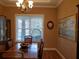 Bright dining room with large windows and hardwood floors at 765 E Chapman Rd, Oviedo, FL 32765