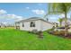 House exterior showcasing a grassy backyard at 811 Pebble Crest Ln, Eagle Lake, FL 33839