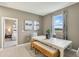 Bright dining room with white table and bench, offering a view of a bedroom and backyard at 811 Pebble Crest Ln, Eagle Lake, FL 33839