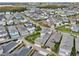 Aerial view of a neighborhood with tree-lined streets and homes at 8760 Shapley St, Orlando, FL 32827