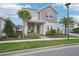 Two-story house with gray siding and palm trees at 8760 Shapley St, Orlando, FL 32827