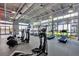 Modern fitness center with various cardio equipment and large windows at 8760 Shapley St, Orlando, FL 32827