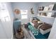 Virtually staged bedroom with a twin bed, playful decor, and built-in shelves at 8969 Sheppard Dr, Lake Wales, FL 33898