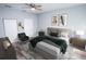 Spacious bedroom with wood-look floors and ceiling fan at 8969 Sheppard Dr, Lake Wales, FL 33898