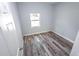 Bright bedroom with wood-look floors and neutral walls at 8969 Sheppard Dr, Lake Wales, FL 33898