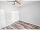 Empty bedroom with wood-look floors and double closets at 8969 Sheppard Dr, Lake Wales, FL 33898