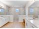 Elegant bathroom with walk-in shower, double vanity, and modern finishes at 9849 Lost Creek Dr, Winter Garden, FL 34787