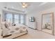 Spacious primary bedroom with large windows and plenty of natural light at 9849 Lost Creek Dr, Winter Garden, FL 34787