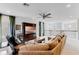 Bright bonus room featuring a sectional sofa and wall-mounted TV at 9849 Lost Creek Dr, Winter Garden, FL 34787