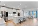 Modern kitchen with white cabinets, quartz countertops, and stainless steel appliances at 9849 Lost Creek Dr, Winter Garden, FL 34787
