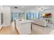 Modern kitchen with white cabinets, quartz countertops, and stainless steel appliances at 9849 Lost Creek Dr, Winter Garden, FL 34787