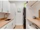 Convenient laundry room with washer, dryer, and extra storage at 9849 Lost Creek Dr, Winter Garden, FL 34787