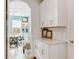 Bright and airy home office with built-in shelving and natural light at 9849 Lost Creek Dr, Winter Garden, FL 34787