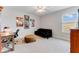 Home office with a desk, futon, and vintage travel posters at 9849 Lost Creek Dr, Winter Garden, FL 34787