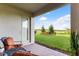 Relaxing covered patio with seating area and lake view at 9849 Lost Creek Dr, Winter Garden, FL 34787
