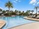 Relaxing community pool with lounge chairs at 9849 Lost Creek Dr, Winter Garden, FL 34787