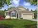 Two-story house with stone and shingle accents at 108 Burlington Pl, Poinciana, FL 34758