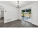 Dining area with chandelier and sliding doors to backyard oasis at 1189 W Page Dr, Deltona, FL 32725