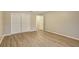 Bedroom with double door closet and wood-look floors at 1215 Waverly Way, Longwood, FL 32750