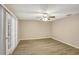 Living room with wood-look floors and sliding glass doors at 1215 Waverly Way, Longwood, FL 32750