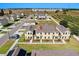 Aerial view showcasing a townhouse and its neighborhood at 141 Holly Village Dr, Davenport, FL 33837
