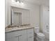 Bathroom with granite countertop, single sink, and bathtub at 141 Holly Village Dr, Davenport, FL 33837