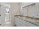 Double vanity bathroom with granite countertop and access to shower at 141 Holly Village Dr, Davenport, FL 33837