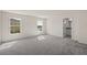 Spacious bedroom with carpet flooring and two large windows at 141 Holly Village Dr, Davenport, FL 33837