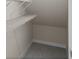 Small closet with wire shelving for storage at 141 Holly Village Dr, Davenport, FL 33837