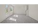 Living room with grey carpet, stairs, and door to outside at 141 Holly Village Dr, Davenport, FL 33837
