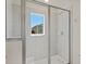 Shower stall with glass enclosure and window at 141 Holly Village Dr, Davenport, FL 33837