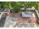 Overhead view of the home's backyard and adjacent shed at 1725 Singing Palm Dr, Apopka, FL 32712