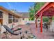 Brick patio with pergola, grill, and workout equipment at 1725 Singing Palm Dr, Apopka, FL 32712