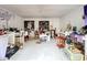 Unfinished basement with various items and wall art at 1725 Singing Palm Dr, Apopka, FL 32712