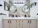 Modern bathroom with double vanity, marble tile, and updated fixtures at 1725 Singing Palm Dr, Apopka, FL 32712