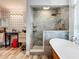 Spa-like bathroom with walk-in shower and soaking tub at 1725 Singing Palm Dr, Apopka, FL 32712