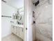 Updated bathroom with marble shower and double vanity at 1725 Singing Palm Dr, Apopka, FL 32712