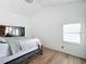 Bright bedroom featuring a king-size bed and vaulted ceilings at 1725 Singing Palm Dr, Apopka, FL 32712
