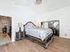 Spacious main bedroom with wood floors and access to backyard at 1725 Singing Palm Dr, Apopka, FL 32712