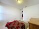 Cozy bedroom with wood-look flooring and a dresser at 1725 Singing Palm Dr, Apopka, FL 32712