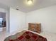 Bright bedroom with tiled floors and a dresser at 1725 Singing Palm Dr, Apopka, FL 32712