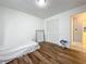 Bright bedroom with wood flooring and ample closet space at 1725 Singing Palm Dr, Apopka, FL 32712
