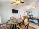 Bright dining area with a table, chairs, and kitchen view at 1725 Singing Palm Dr, Apopka, FL 32712