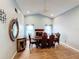 Elegant dining room featuring a large table and chandelier at 1725 Singing Palm Dr, Apopka, FL 32712