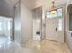 Bright entryway with tile floors and high ceilings at 1725 Singing Palm Dr, Apopka, FL 32712